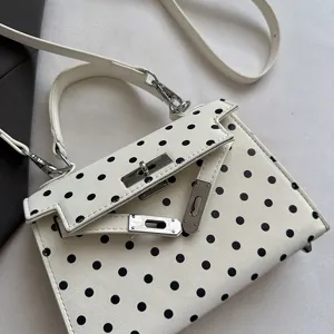White black polka dot handbag stylish top handle shoulder crossbody bag detail view