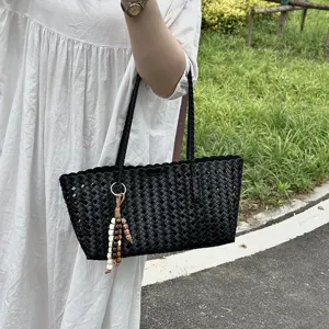 Large capacity woven tote bag for women, stylish hollow out shoulder bag with bead pendant.