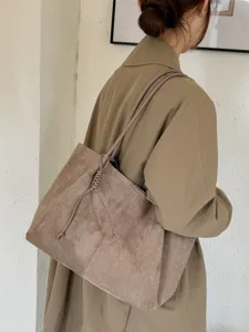 Large capacity commuter shoulder tote bag for women, retro suede style, autumn fashion look.