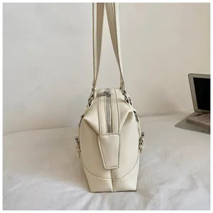 Detailed side view of off-white retro underarm shoulder bag, PU leather, daily casual commuting.