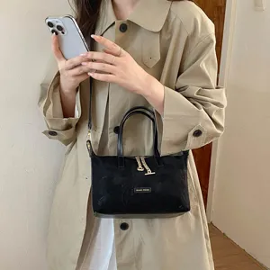 Black suede top handle crossbody bag for women, retro solid color daily casual shoulder bag.