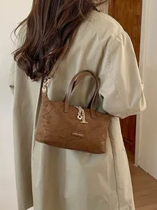 Retro brown suede small handbag with metal chain strap and top handle for women daily fashion.