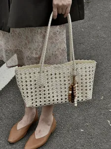 Chic woven tote bag for women, large capacity cutout summer shoulder bag with cute bead charm.