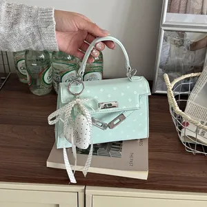 Mint green polka dot Kelly handbag for women, cute mini top handle shoulder bag.