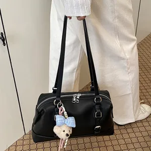 Retro black underarm shoulder bag detail showing premium faux leather and chic cute bear charm.