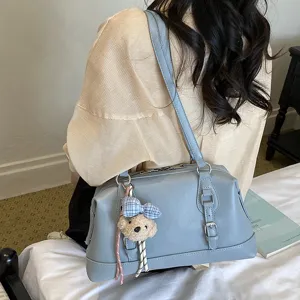 Retro light blue shoulder bag detail with cute bear pendant, stylish casual daily purse.