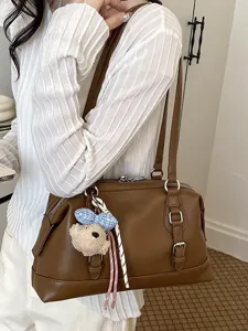 Retro large capacity underarm shoulder bag for women, stylish commuting brown tote bag.