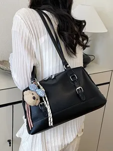 Black leather underarm shoulder bag for women, vintage large capacity commuting daily handbag.