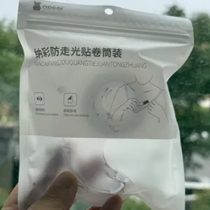 Transparent anti-exposure clothing tape roll for secure dress and strap support.