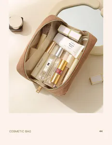 Corduroy cosmetic bag with spacious compartments and zipper closure for daily travel makeup storage.