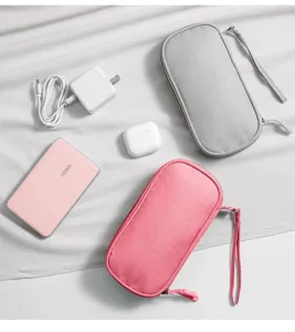 Portable digital storage bag for cables, chargers, and power banks, organized flat lay.