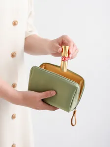 Portable mini green cosmetic bag with zipper makeup pouch for daily travel outdoor use.