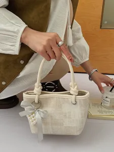 Schicke beige Canvas Eimer Tasche für Damen, stilvoller Knoten Griff mit Perlen Schleife.