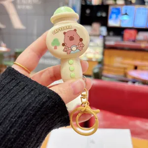 Cute mini microphone keychain featuring a fun Capybara design, perfect music toy bag pendant.