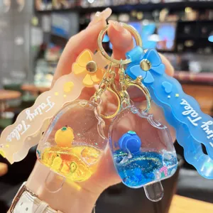Acrylic quicksand ice cream keychain pendant with cute floating beads and bow design.