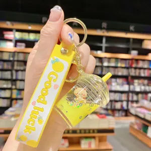 Llavero de té de burbujas amarillo muy lindo con oso flotante líquido y correa.
