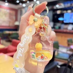 Cute acrylic quicksand ice cream keychain pendant with lovely fruit slices and bowknot charm.
