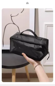 Black mesh cosmetic bag with zipper and handle, portable travel toiletries organizer.