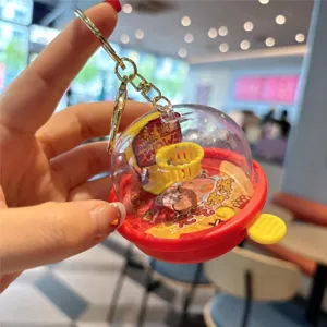 Mini basketball machine keychain detail, transparent dome and cute cartoon design, portable toy.