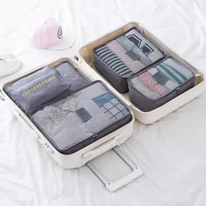 Travel organizer bags set for packing clothes, portable luggage storage cubes for suitcase.