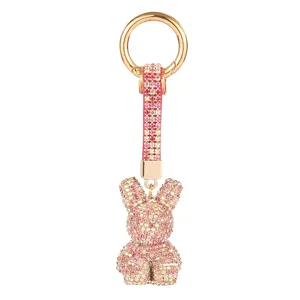Sparkling rhinestone bunny keychain with gold ring and elegant pink crystal pendant for women.