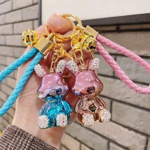 Portachiavi con Coniglio in Metallo Galvanizzato Carino Con Ciondolo Borsa a Coniglio Intarsiato di Strass Lucidi Cordino Intrecciato Campanello Regalo Donna