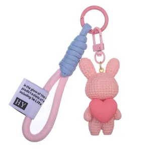Cute resin rabbit keychain with heart pendant, stylish bag charm and car key ring accessory.