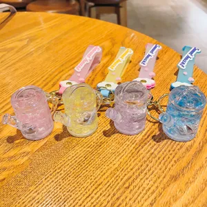 Acryl flüssigkeit Treibsand Gießkanne Schlüsselanhänger mit leuchtenden Lichtern und Perlen.