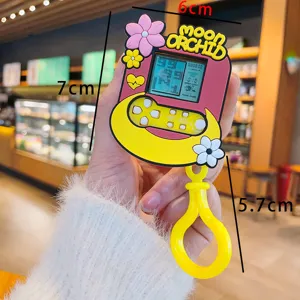 Mini lindo llavero de consola de juegos electrónica de dibujos animados con correa floral