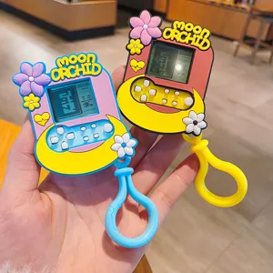 Lindo Llavero de Consola de Juegos de Mini Flor de Cerezo de Dibujos Animados de Plástico Creativo Colgante de Flor de Luna Juguete Electrónico Portátil Llavero Para Bolsa Alivio del Estrés Regalo