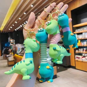 Cute cartoon dinosaur keychain with telescopic neck, fun decompression bag pendant.