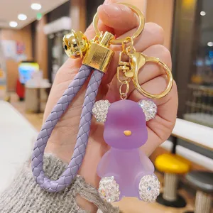 Creative rhinestone jelly bear keychain, exquisite purple PU braided rope and gold metal pendant.