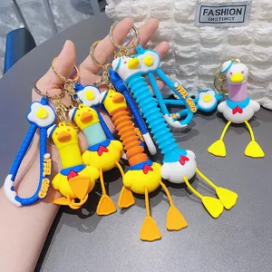 Cute telescopic neck duck keychain decompression toy, funny sailor duck pendant bag accessory.