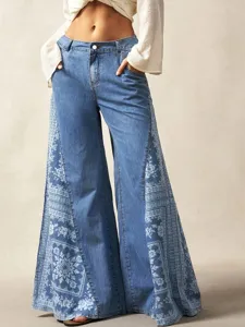 Stylish women's blue wide leg flare jeans featuring side ethnic floral print, bohemian style.