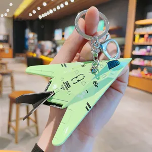 Creative alloy mini fighter jet keychain, cute stealth airplane key ring, bag pendant gift.