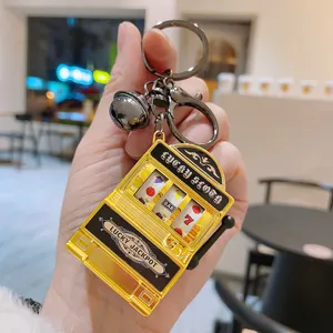 Porte-clés machine à sous en métal, pendentif créatif de jeu de fruits pour les sacs et clés.