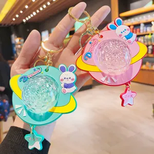 Süßer Cartoon Kaninchen Planet Projektion Schlüsselanhänger, farbiges Licht Spielzeug für Taschen.