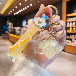 Acryl ölgefüllter Gießkannen Schlüsselanhänger mit Glitzerperlen und Anhänger für Handtasche.