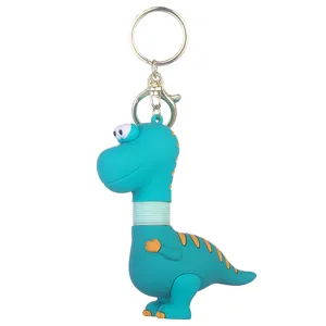 Cute cartoon dinosaur keychain with telescopic neck, fun bag charm and stress relief toy.