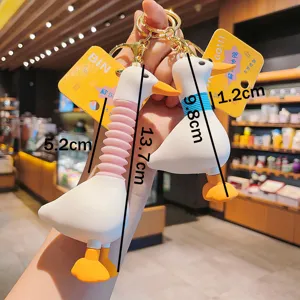 Detail view of the cute stretchable long neck duck keychain, showing size dimensions and yellow tag.