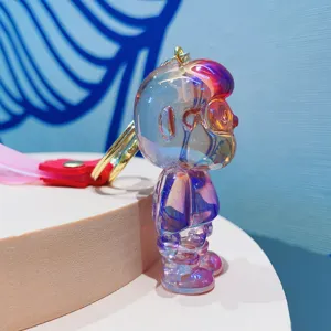 Iridescent translucent cartoon figurine keychain close-up, premium resin material pendant accessory.