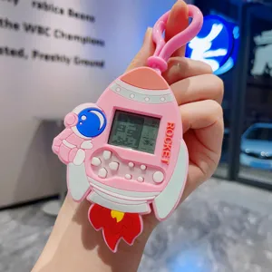 Süßer rosa Rakete Handheld Spielkonsole Schlüsselanhänger mit LCD Bildschirm für Kinder.