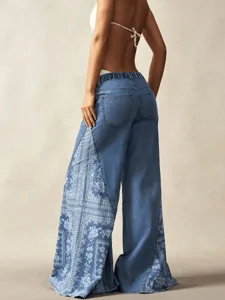Women blue denim wide leg trousers with ethnic side print detail, bohemian style casual wear.