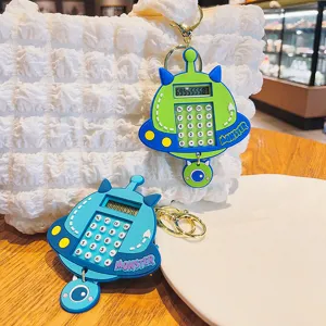 Llavero de calculadora UFO de silicona lindo, colgante de monstruo creativo para mochilas escolares.