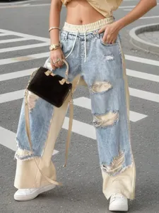 Casual women's straight leg jeans featuring drawstring waist and trendy patchwork design.