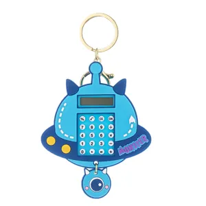 Llavero de calculadora UFO azul lindo con diseño de monstruo para bolso y llaves.