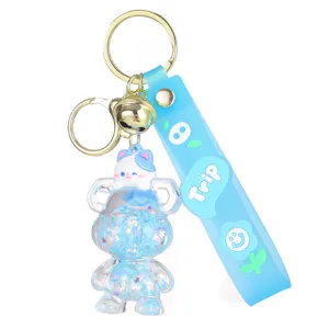 Cute cartoon quicksand bear keychain with cat pendant, glitter liquid bag charm for car keys.