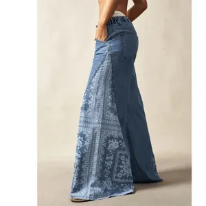 Women's blue high waist wide leg flared jeans with bohemian side print patchwork.