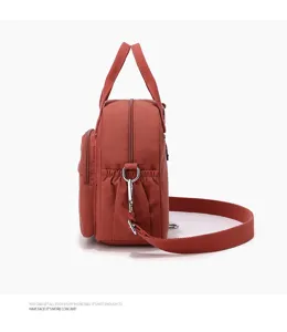 Bolso de hombro casual de nylon para mujer, bolso de viaje ligero con bolsillos prácticos.