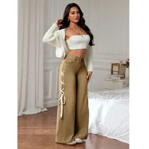Casual wide-leg jeans featuring a loose fit, stylish side ribbon ties, and comfortable high waist.